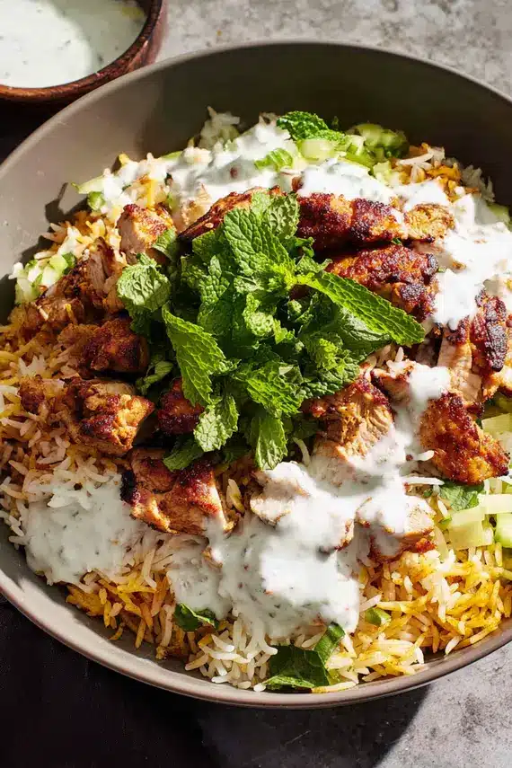 Delicious chicken shawarma rice with white sauce in a bowl
