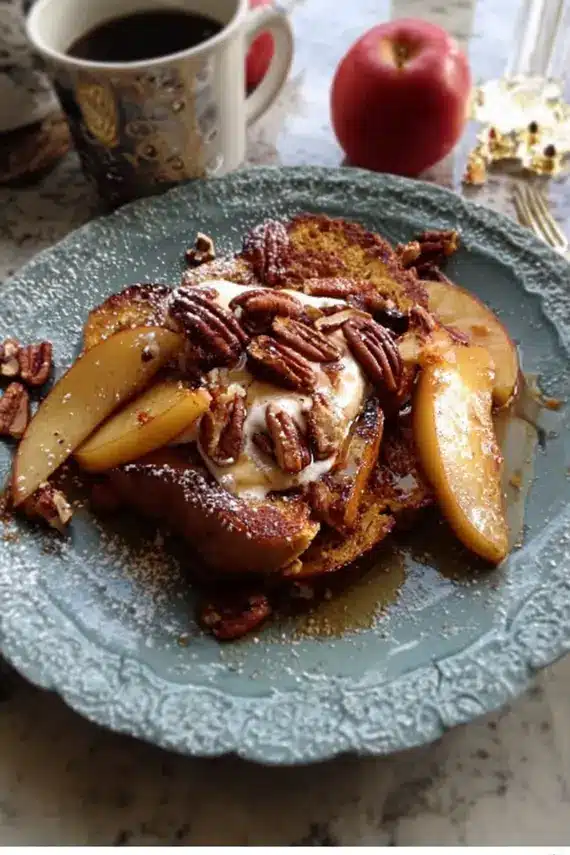 Beautifully served challah french toast with caramelized apple pear and pecan topping