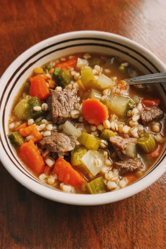 Beef barley soup with fresh bread on the side
