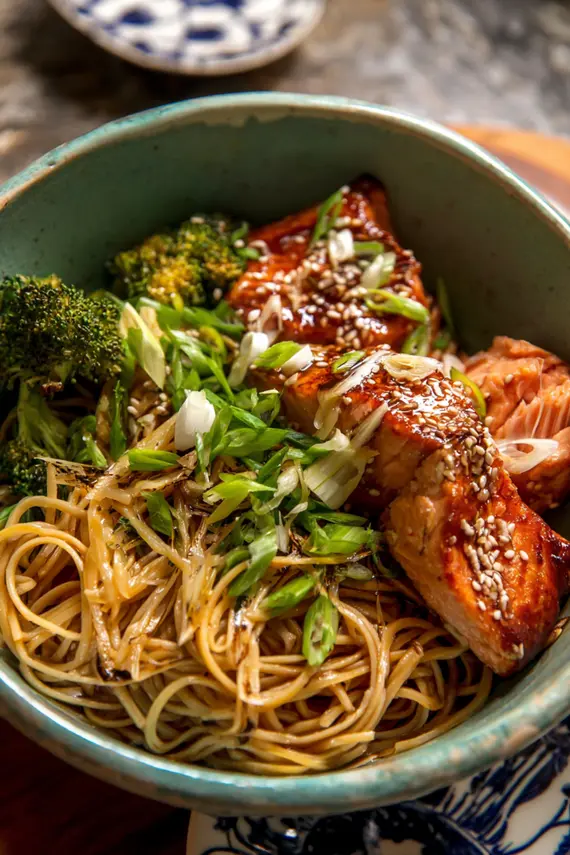 Honey sesame salmon noodles served in a bowl with garnishes
