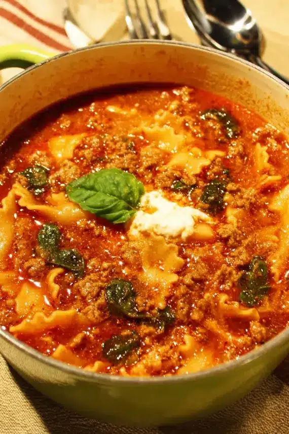 Lasagna soup one pot served with crusty bread and fresh herbs
